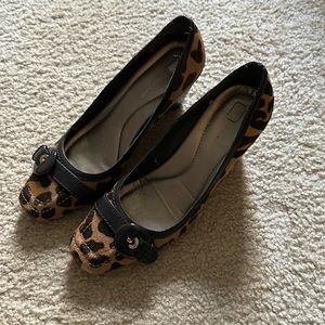 Animal print wedges shoes.